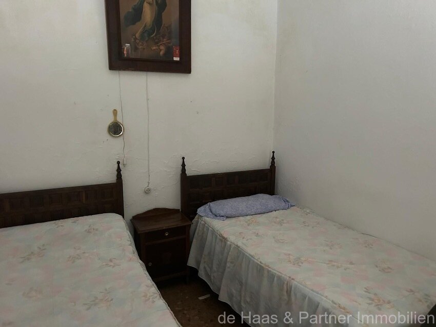 Centrally located townhouse in need of renovation with patio and roof terrace