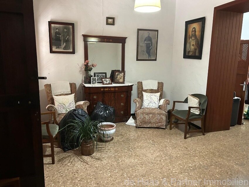 Centrally located townhouse in need of renovation with patio and roof terrace