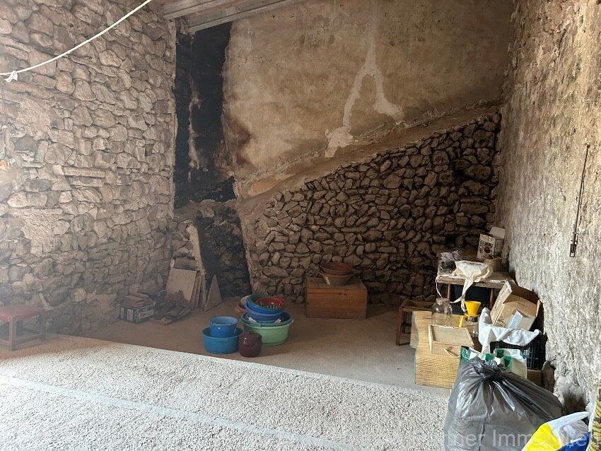 Centrally located townhouse in need of renovation with patio and roof terrace