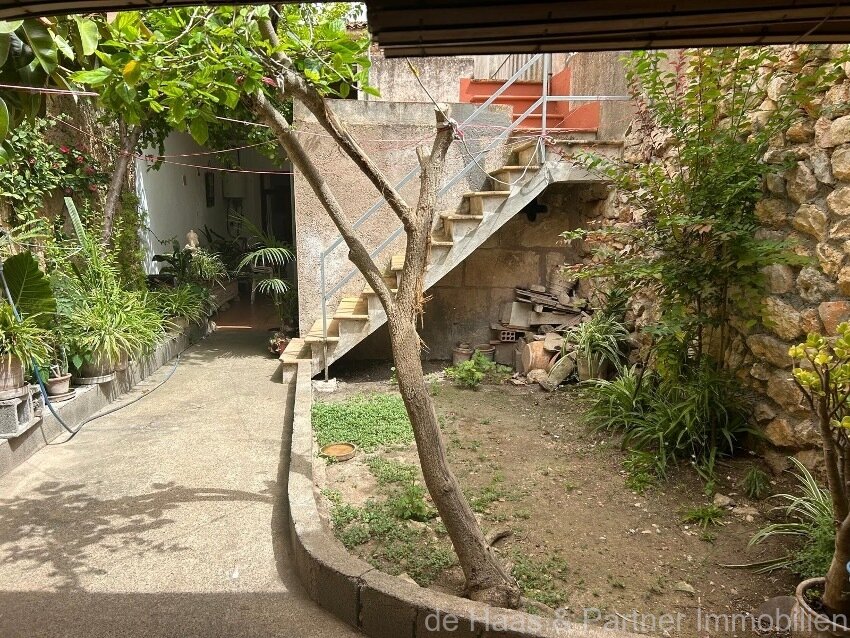 Centrally located townhouse in need of renovation with patio and roof terrace