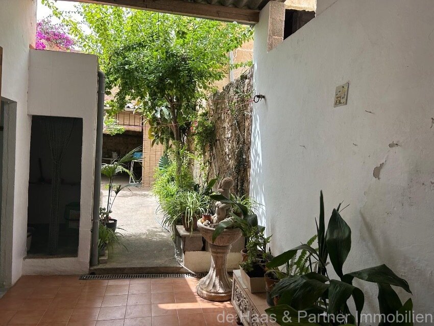 Centrally located townhouse in need of renovation with patio and roof terrace