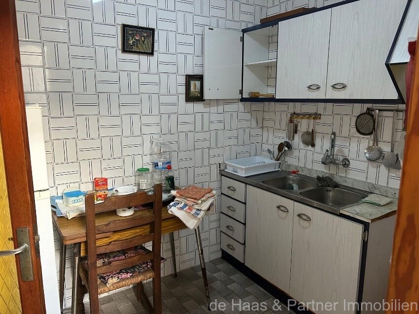 Centrally located townhouse in need of renovation with patio and roof terrace