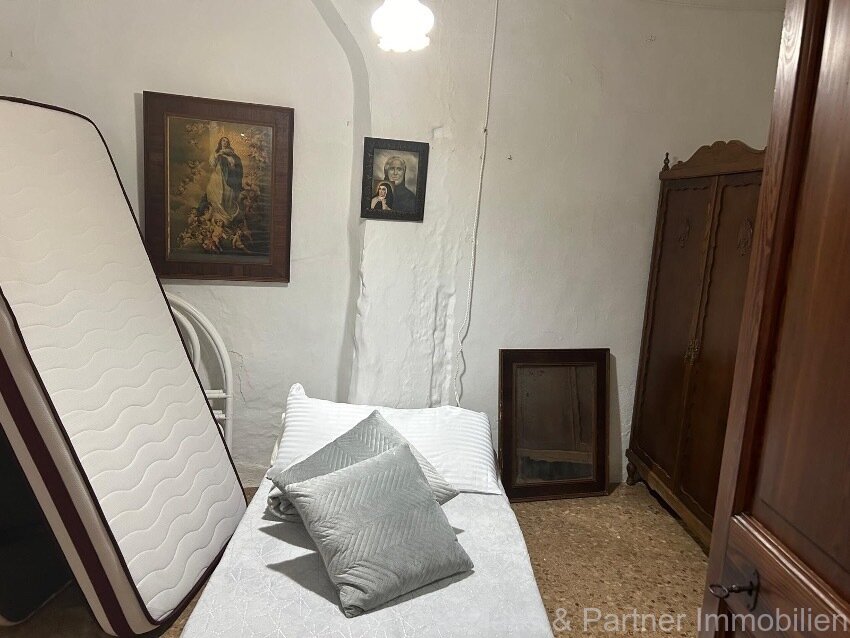 Centrally located townhouse in need of renovation with patio and roof terrace