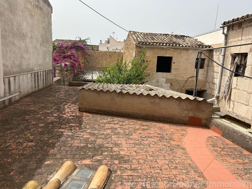 Centrally located townhouse in need of renovation with patio and roof terrace