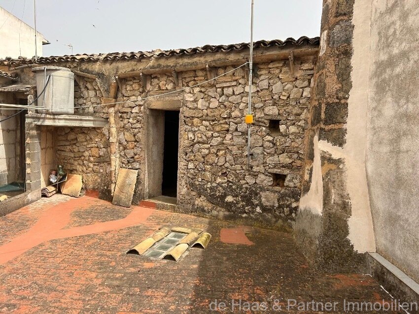 Centrally located townhouse in need of renovation with patio and roof terrace