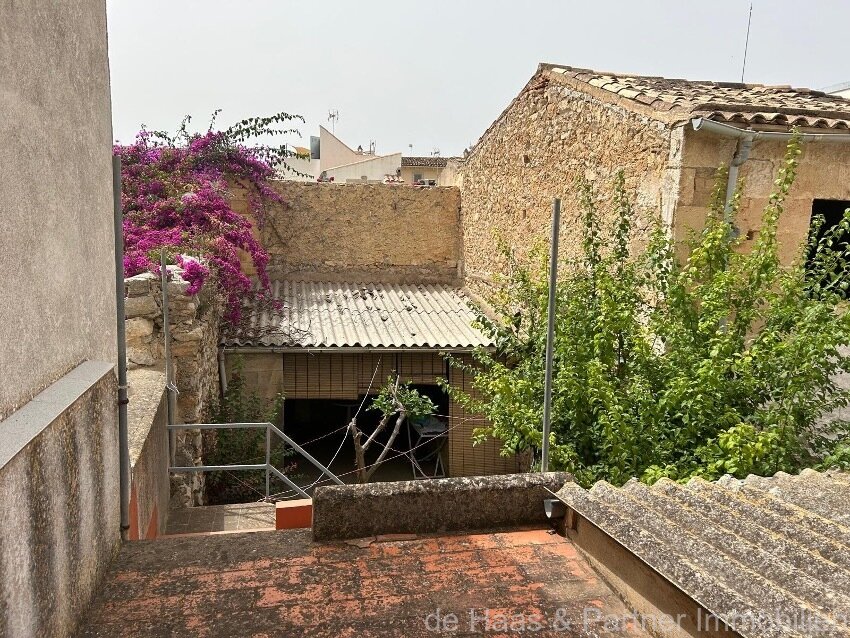 Centrally located townhouse in need of renovation with patio and roof terrace