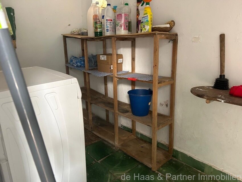 Centrally located townhouse in need of renovation with patio and roof terrace