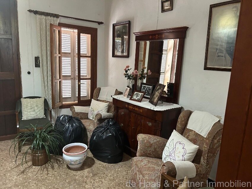 Centrally located townhouse in need of renovation with patio and roof terrace